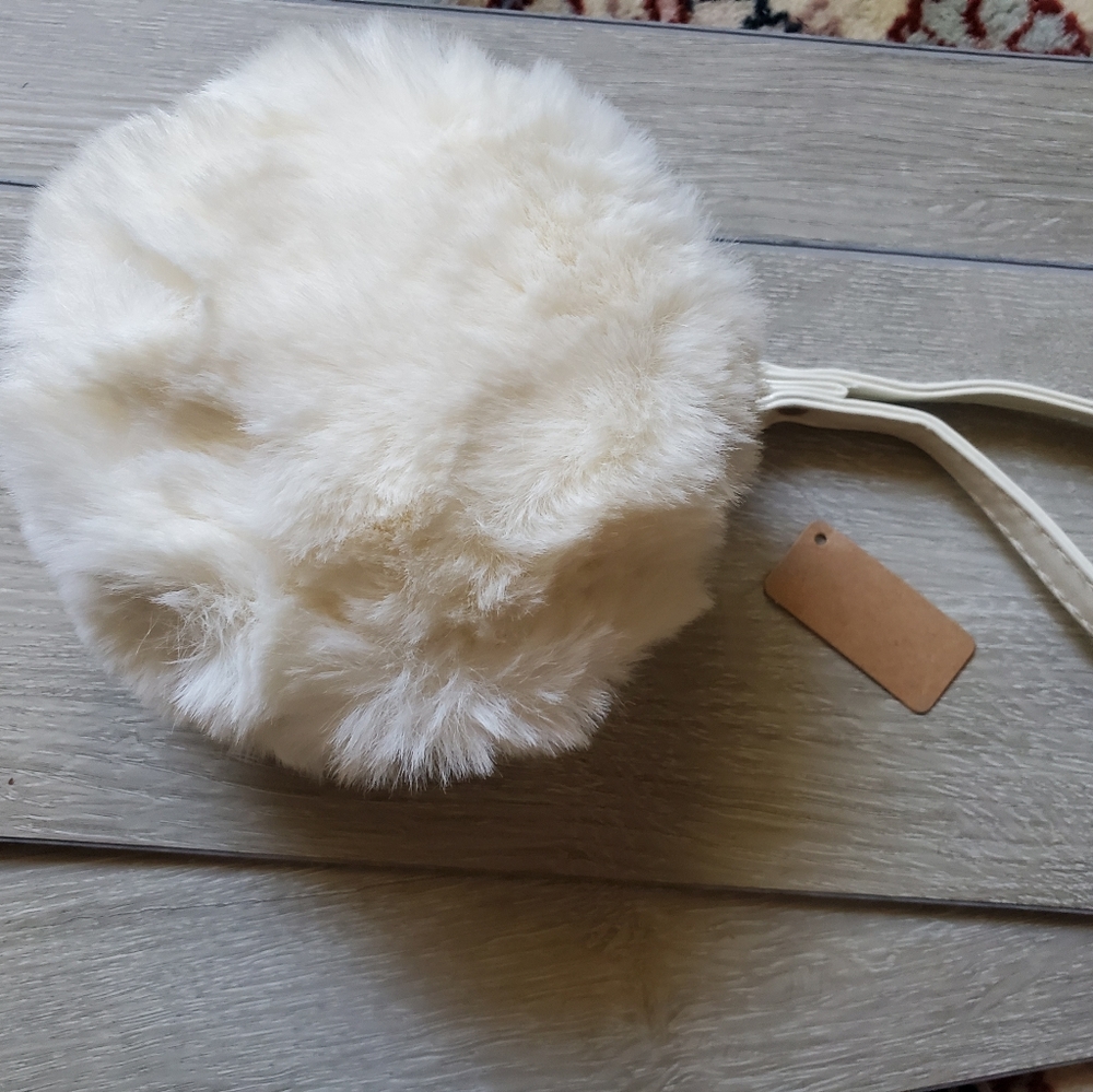 Cutest wristlet ever. call "Snowball" room for